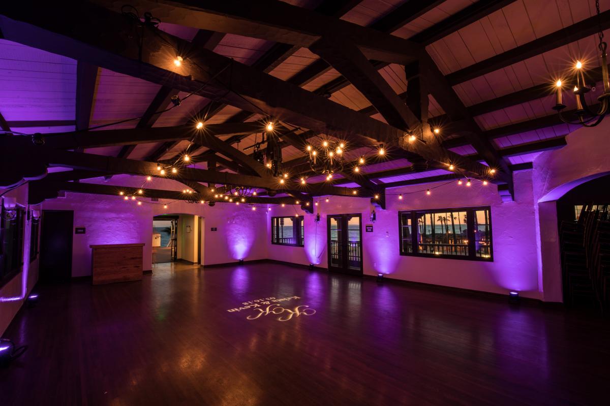 The Ole Hanson Beach Club Main Room lit up with purple lighting in the evening